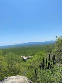 the view from the top of a mountain overlooking the desert