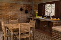 a small kitchen with a table and chairs