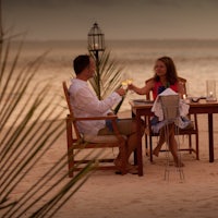 a couple sitting at a table