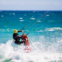 a man is kitesurfing in the ocean