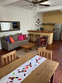 a living room with a table and chairs